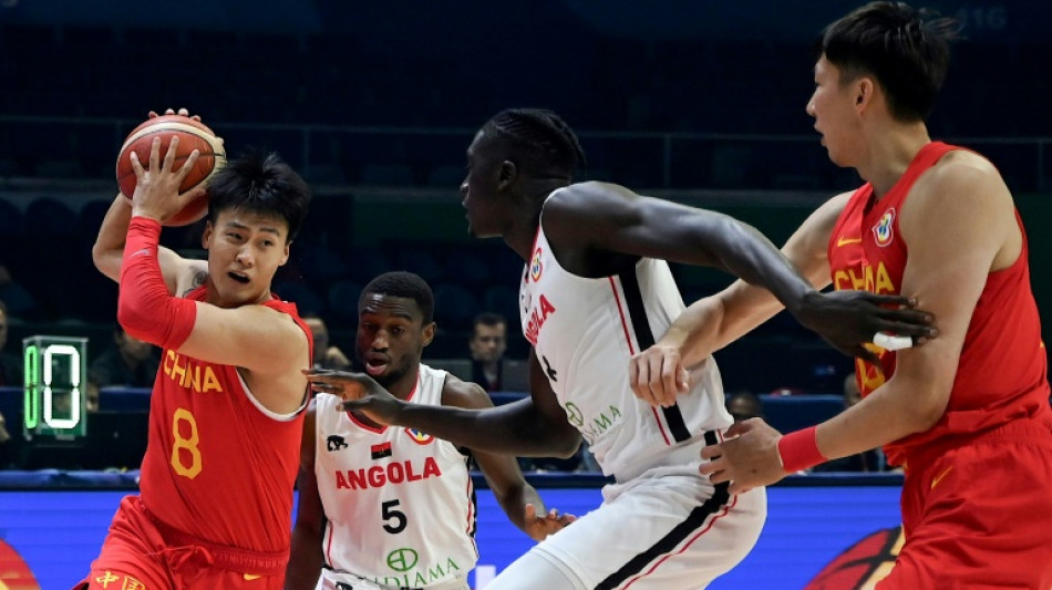 China's first win puts them back into Olympic basketball contention