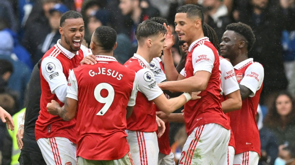 Arsenal back on top, Salah double lifts Liverpool