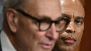 Gold hits record, dollar drops as US shutdown looms