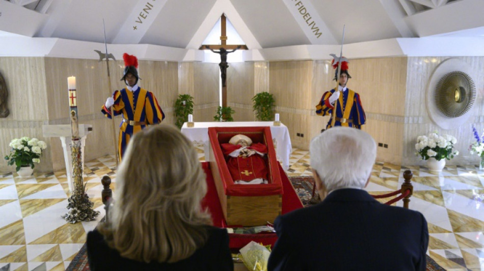 Pope's Vatican 'family' pay tearful respects