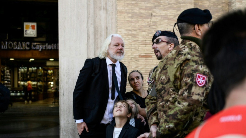 Wikileaks founder Assange joins crowds for pope funeral