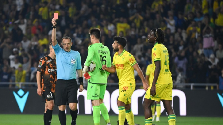 Marseille squander lead in draw with 10-man Nantes