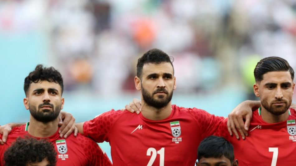 As protests rage in Iran, team fall silent for anthem at World Cup