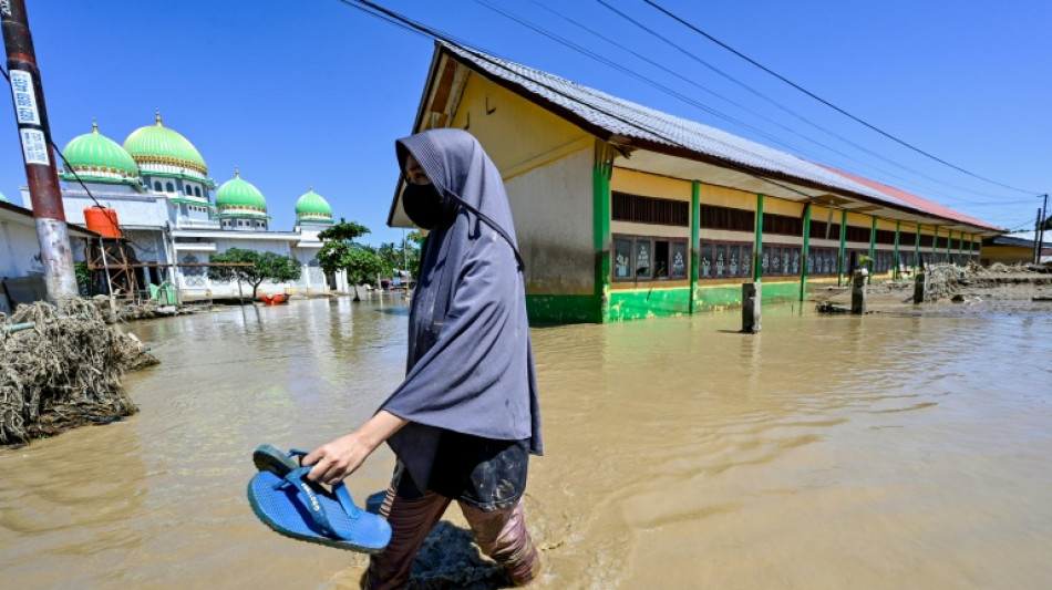 Race to get aid to Asia flood survivors as toll nears 1,200